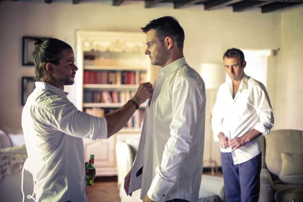 Dressing the Groom. Whilst getting ready for a French wedding.