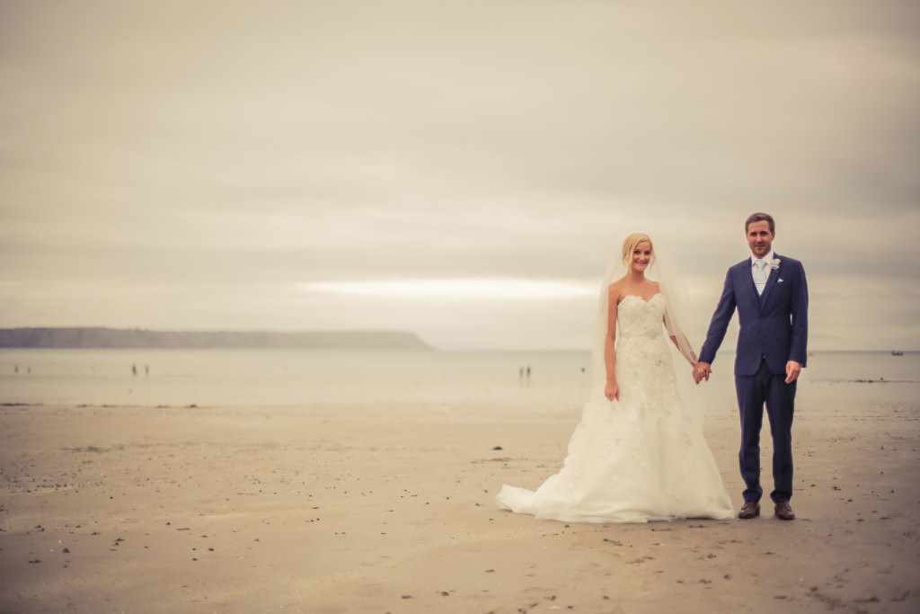 Wedding on the beach with bride and groom in Cornwall.