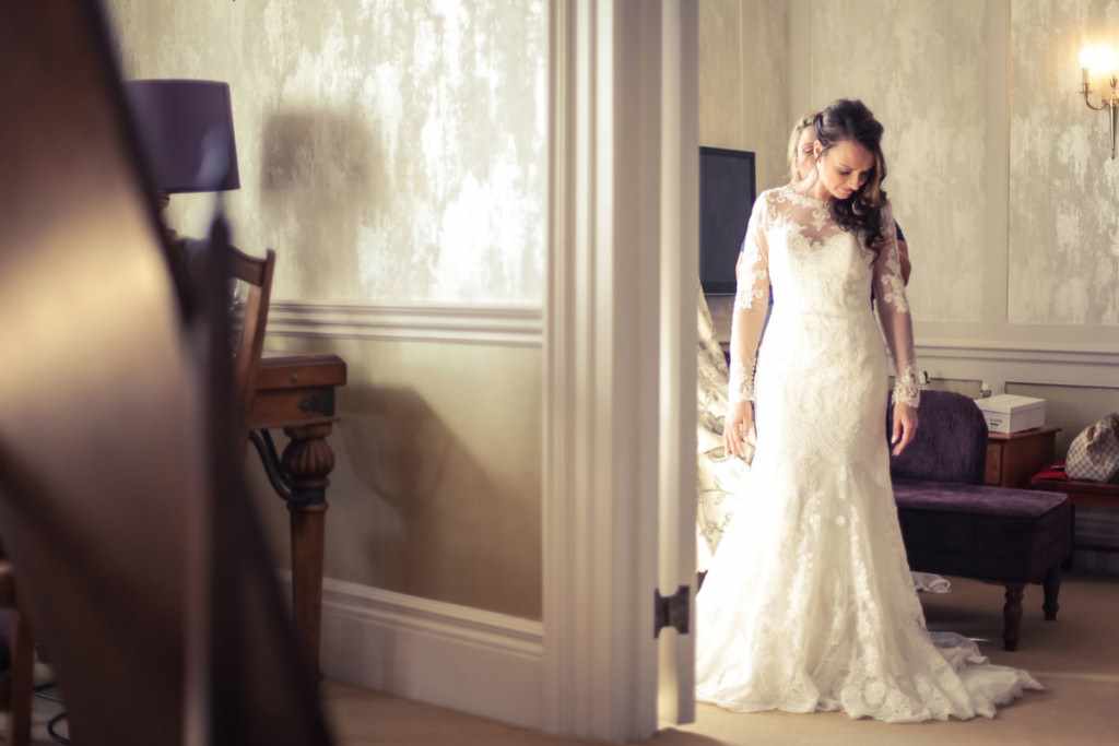 A Bride getting ready for her wedding. In her wedding dress in a room in a wedding venue in Devon