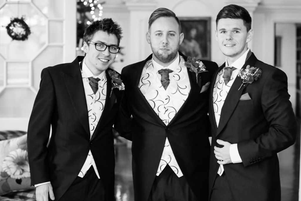 The groom and the groomsmen at a wedding by a Cornwall wedding photographer