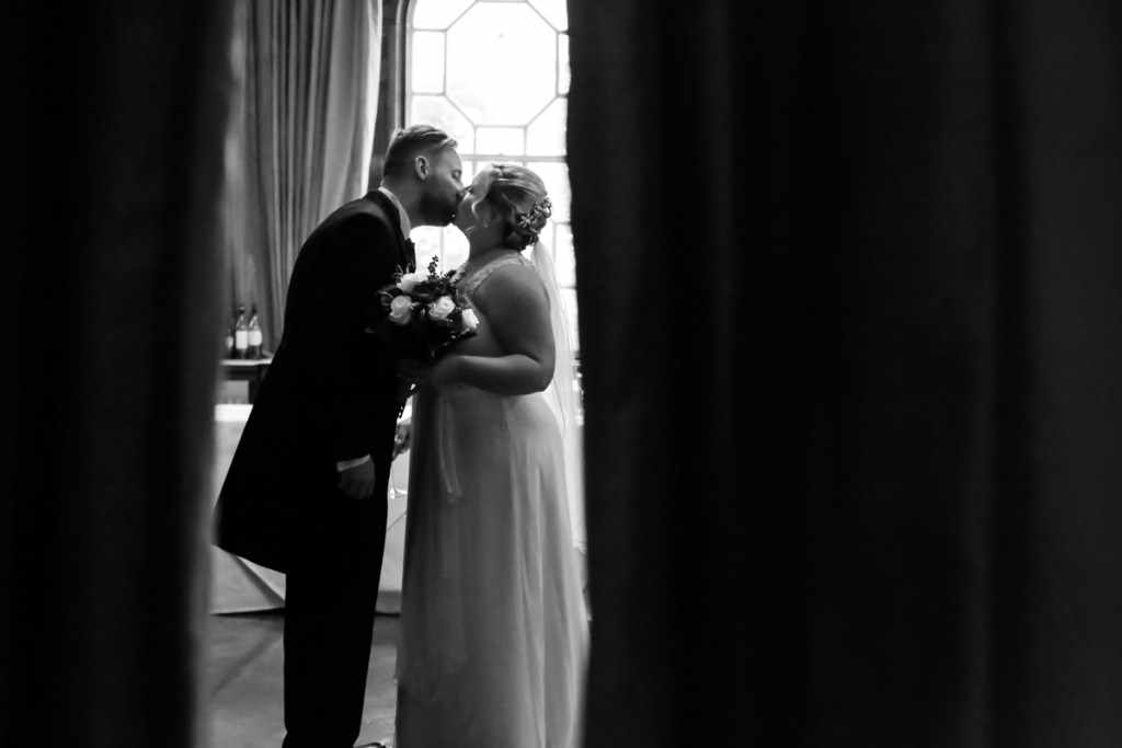 Bride and Groom kissing in a natural way during a Cornish wedding. 