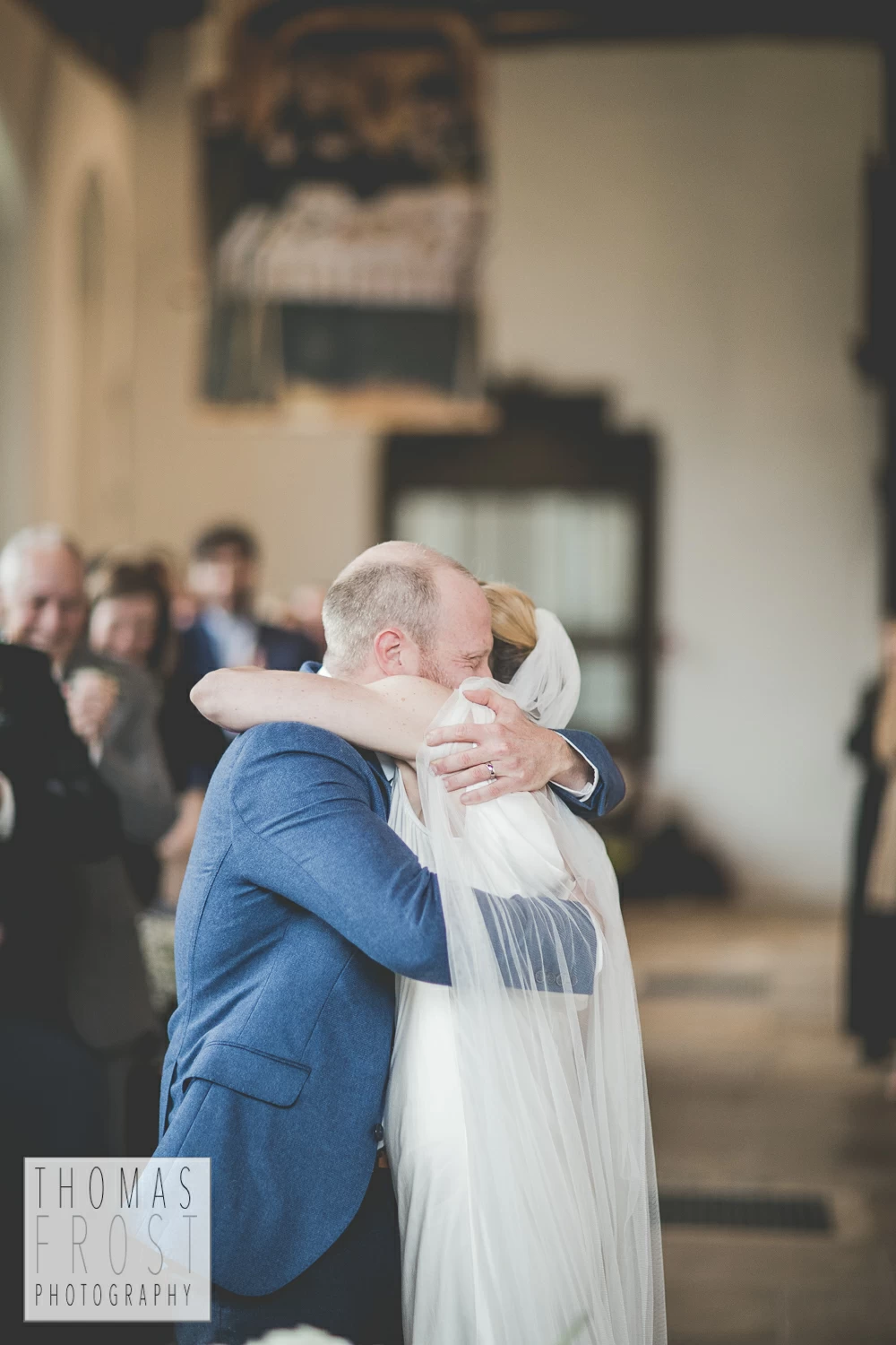 Bride and groom hugging after wedding at Prittlewell Priory Wedding, Southend-on-sea.