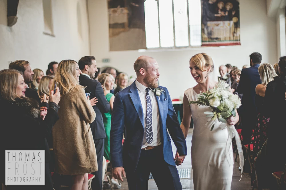 walking down the isle at Prittlewell Priory Wedding, Southend-on-sea.