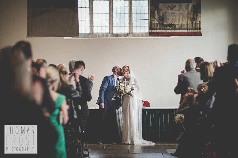 Groom kissing the bride at Prittlewell Priory Wedding, Southend-on-sea.
