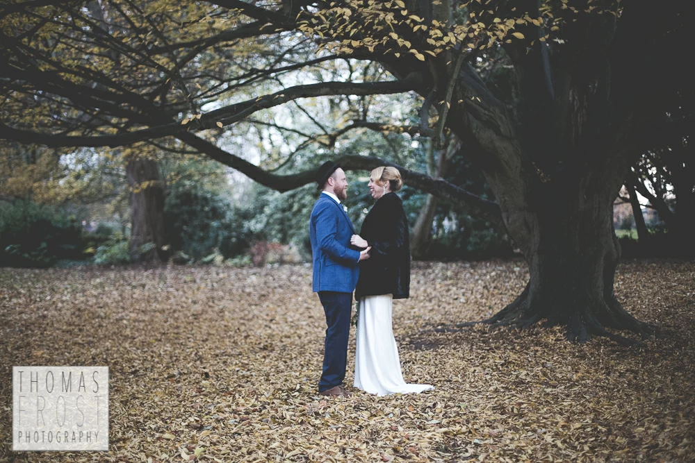 Bride and Groom under a tree at Prittlewell Priory Wedding, Southend-on-sea.
