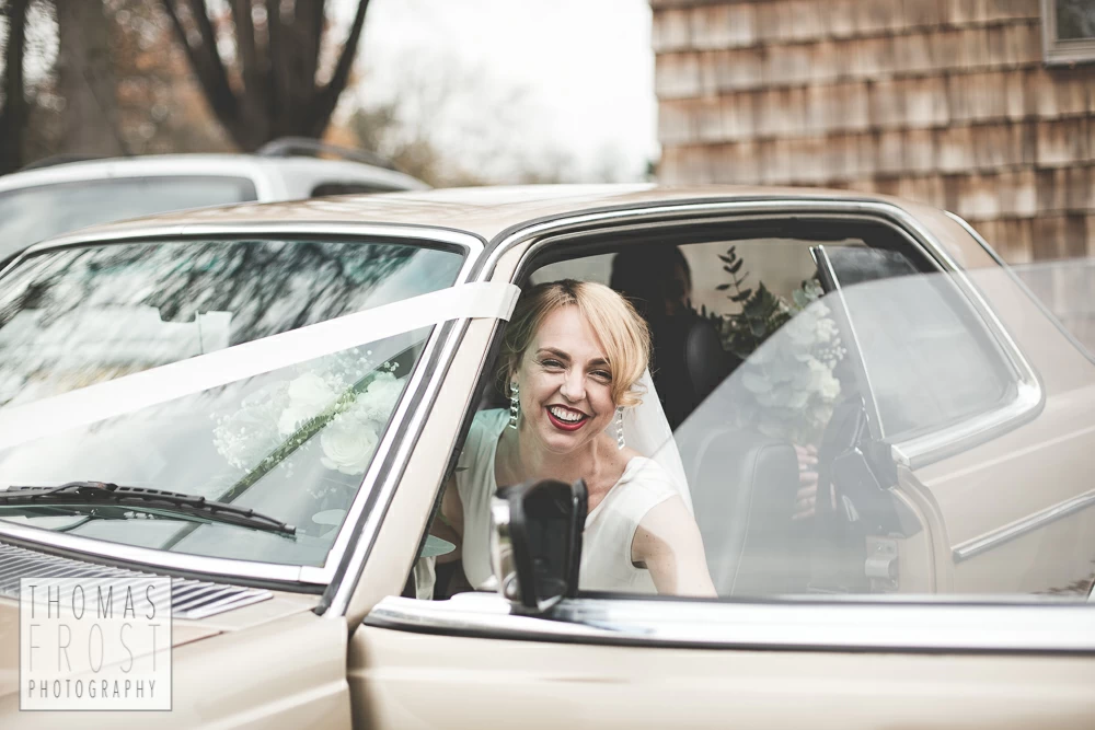 Bride getting out of wedding car at Prittlewell Priory Wedding, Southend-on-sea.
