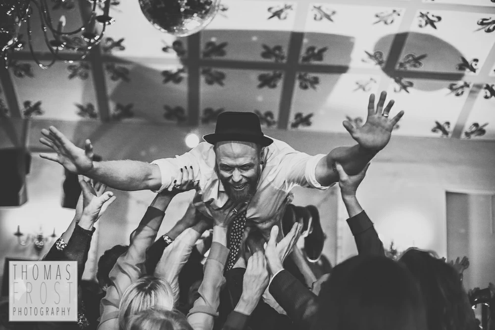 Crowdsurfing groom at Prittlewell Priory Wedding, Southend-on-sea.