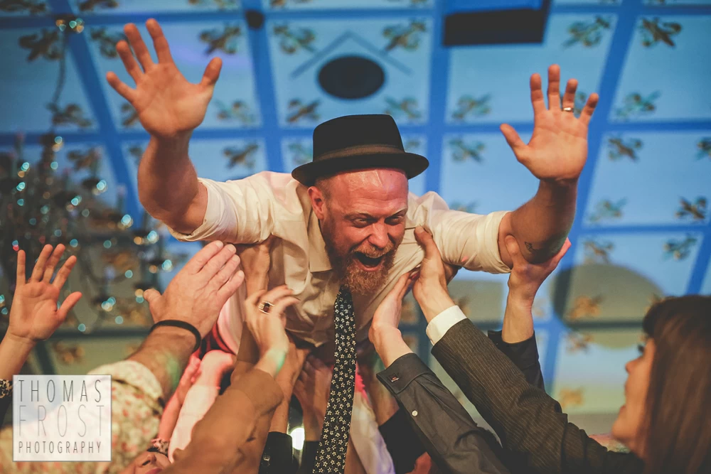 Crowdsurfing Groom at Prittlewell Priory Wedding, Southend-on-sea.