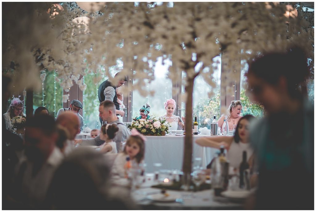 Bride and groom at the top table of their wedding
