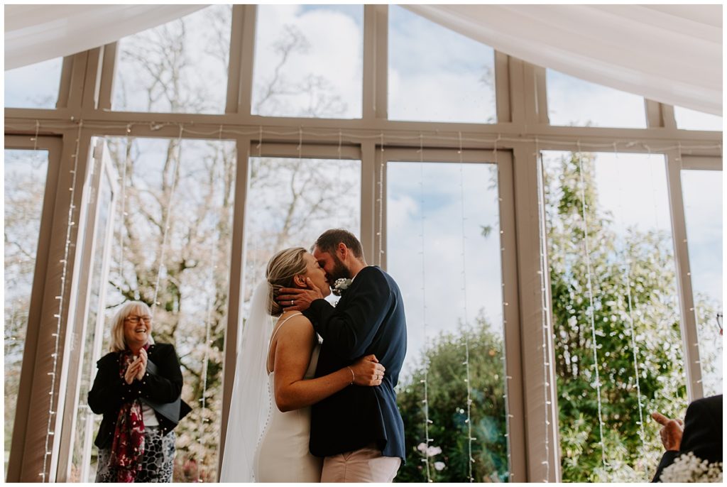 Trevenna Barn Wedding Photography ceremony room first kiss