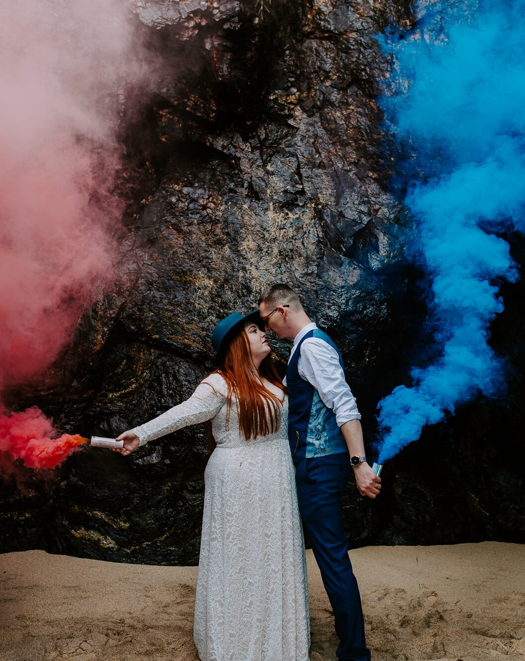 couple with smoke bombs