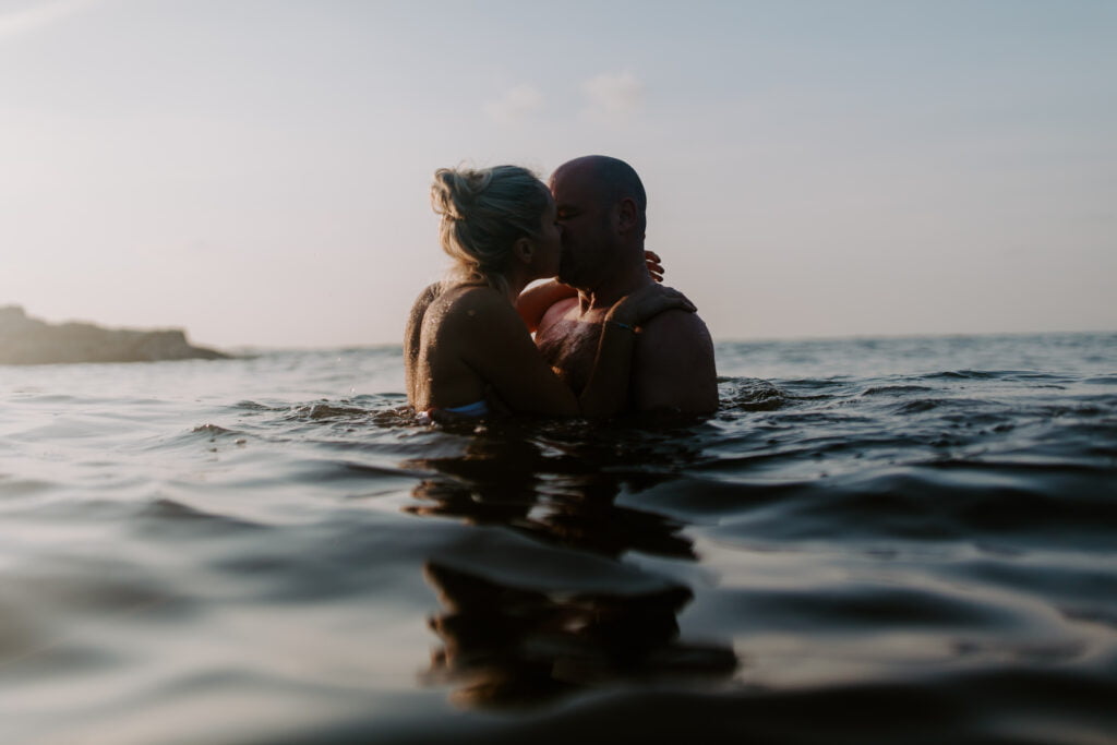 couples swimming in the sea