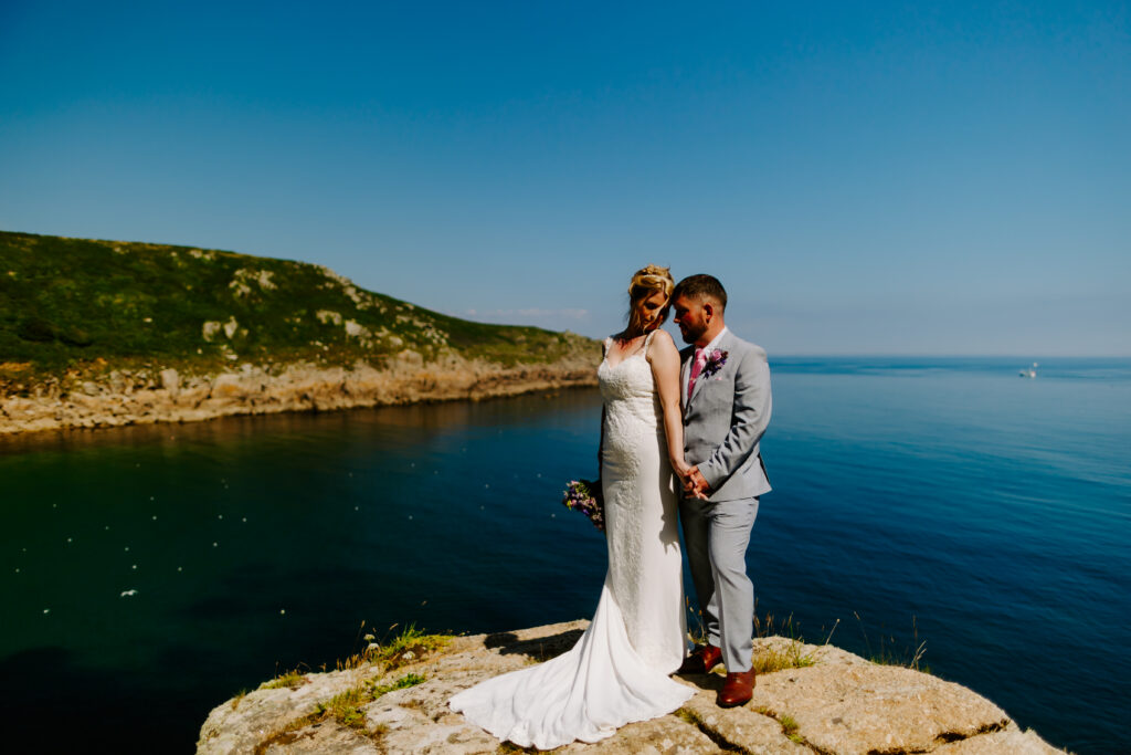 clifftop couple at Cornwall wedding