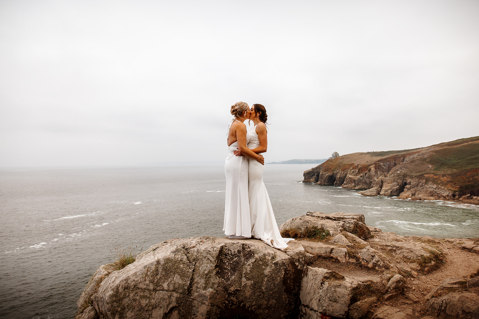 Same sex couple eloping on Cornish cliff, during a Cornwall Elopement