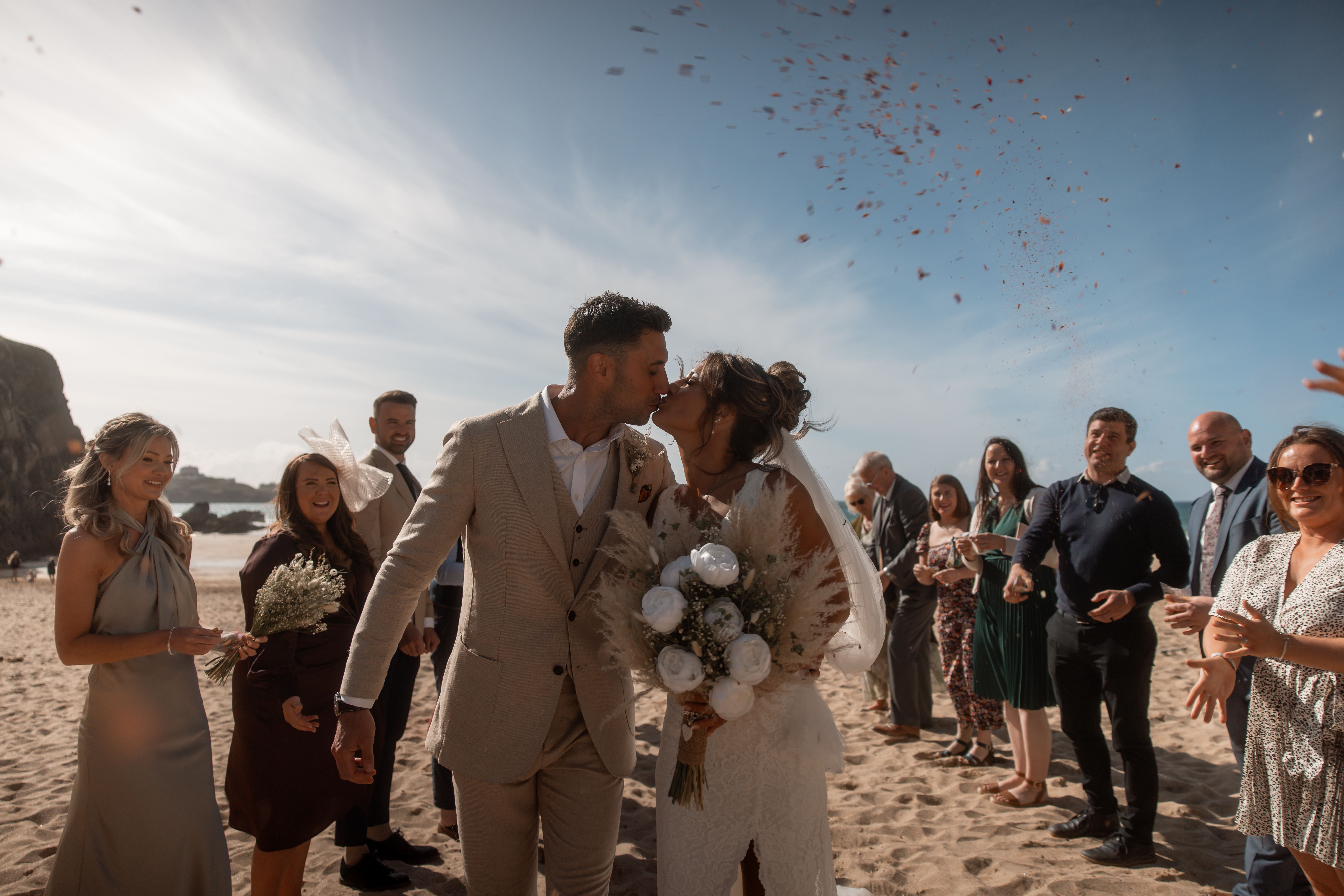 Couple celebrating wedding on beach.
