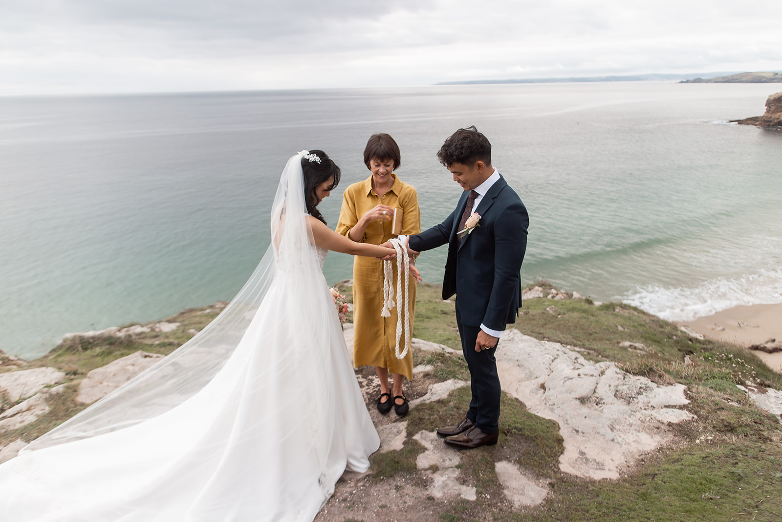 Cliff top wedding in cornwall. A hand fasting on teh cliffs